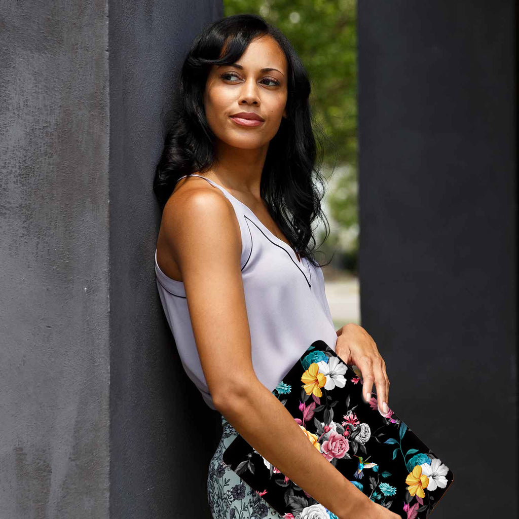 A yong girl holding personalized microsoft surface laptop case with Black Flower design