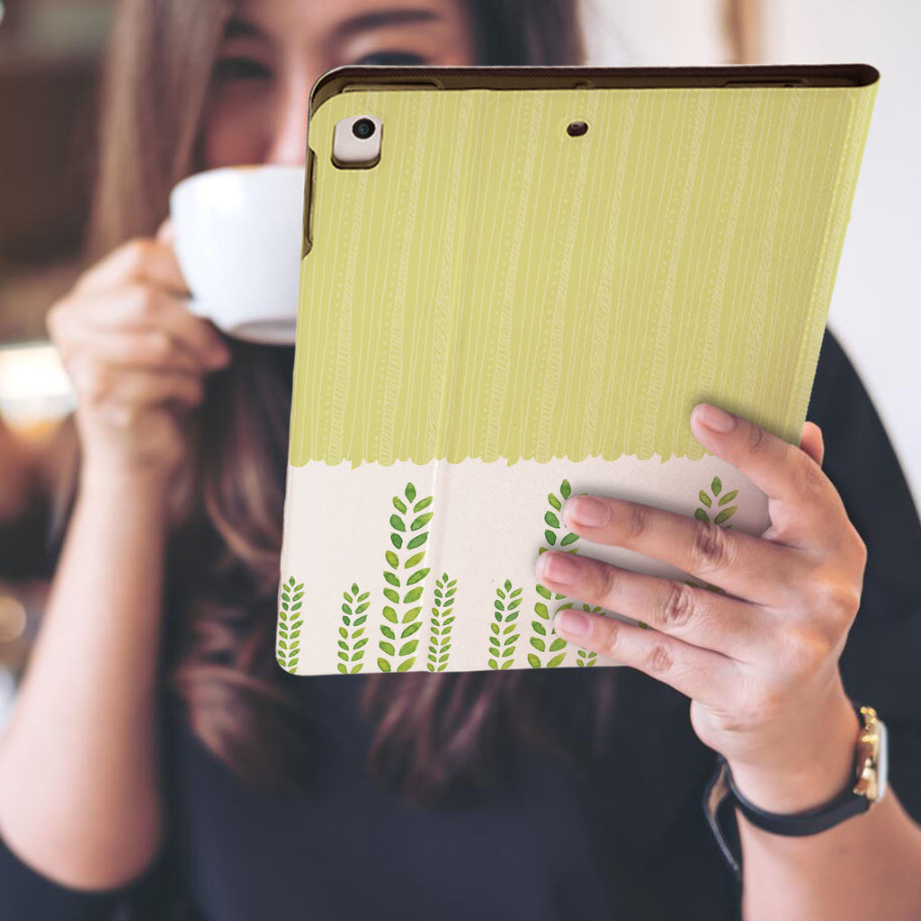 a girl is holding and viewing personalized iPad folio case with Cute Animal 2 design