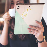 a girl is holding and viewing personalized iPad folio case with Simple Scandi Luxe design