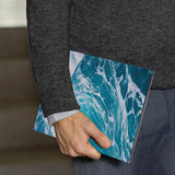 A business man holds Personalized VistaCase reMarkable Pen Holder Case with Sea Waves design