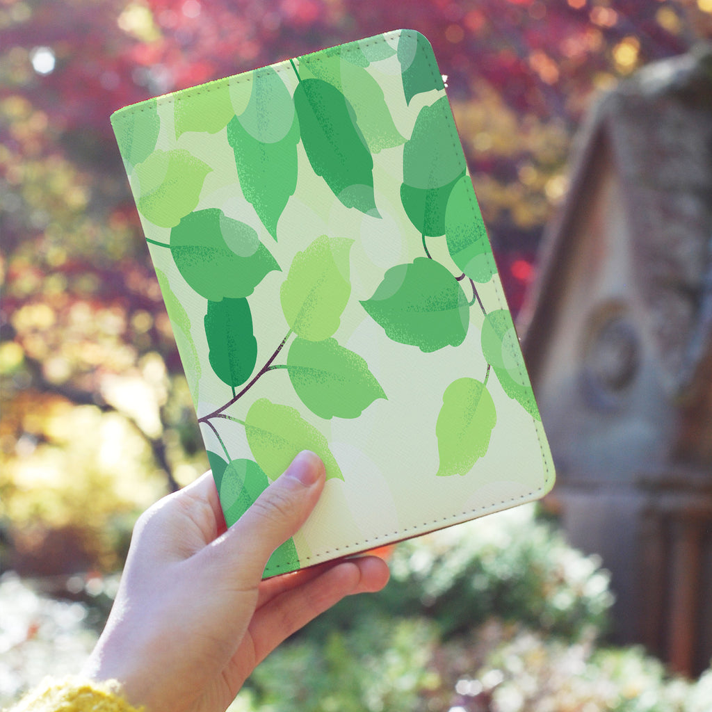 a girl holding personalized RFID blocking passport travel wallet with Leaves design