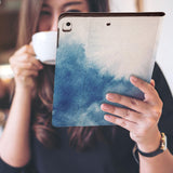 a girl is holding and viewing personalized iPad folio case with Abstract Ink Painting design 