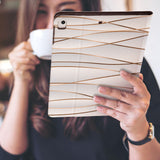 a girl is holding and viewing personalized iPad folio case with Luxury design 