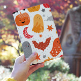 a girl holding personalized RFID blocking passport travel wallet with Halloween design